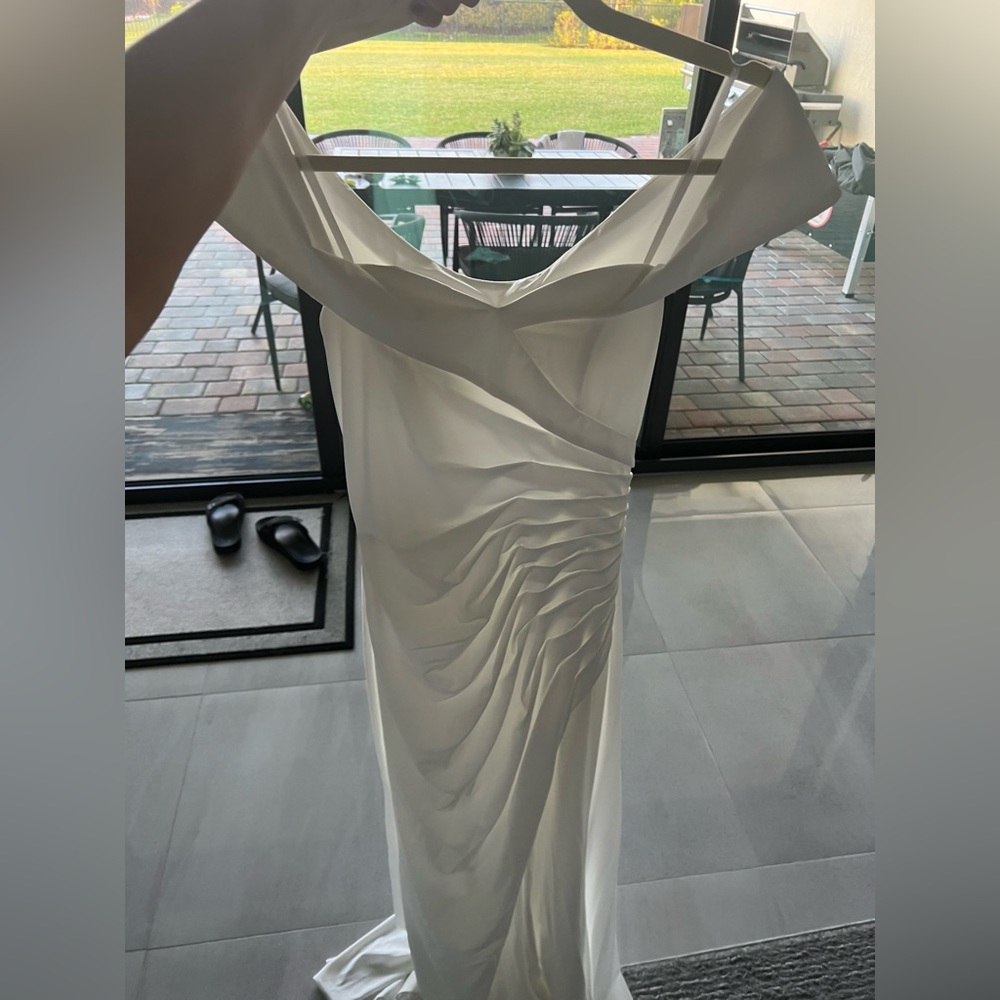 Beautiful white gown. Ideally for a wedding.